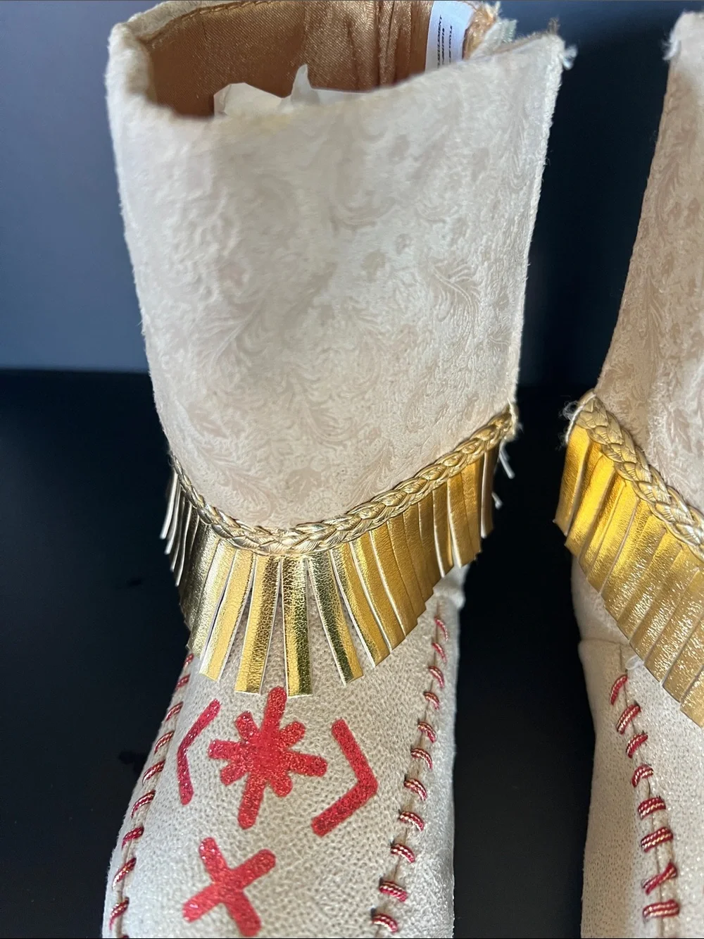 Disney Beige Moccasin Boots with Gold Fringe and Red Embroidery